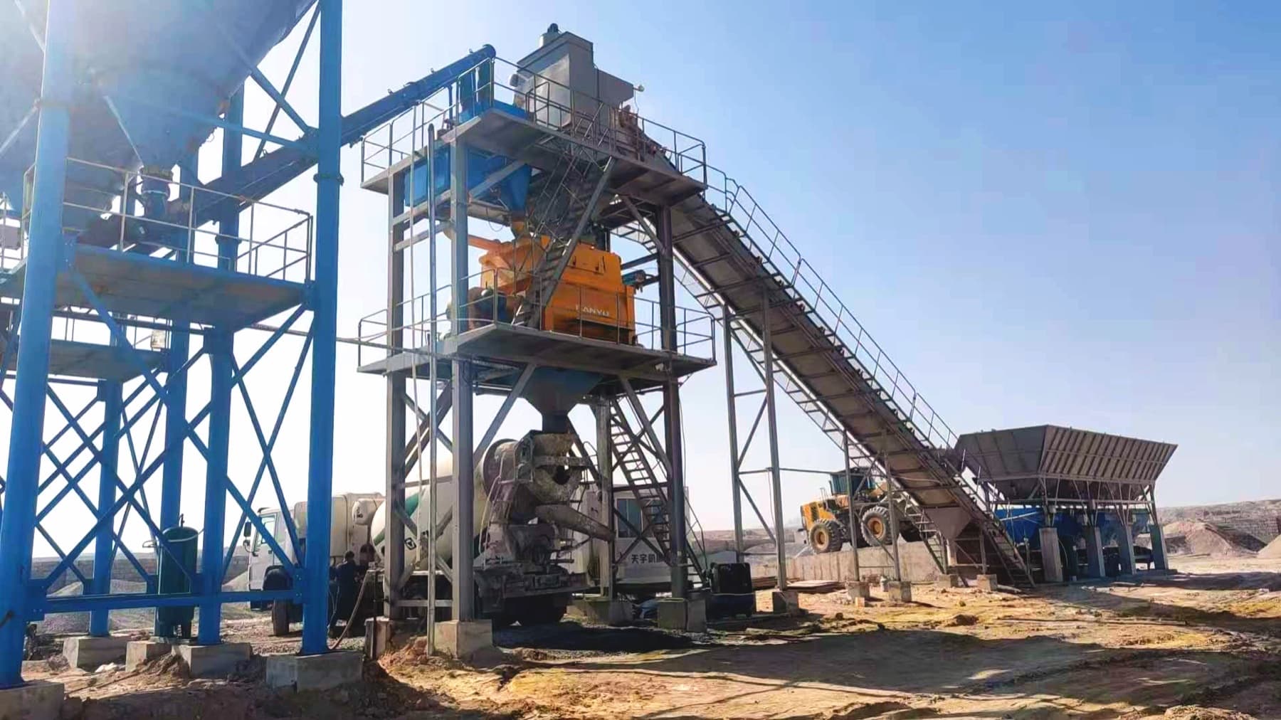Concrete mixer truck loading under the TIANYU HZS180 plant