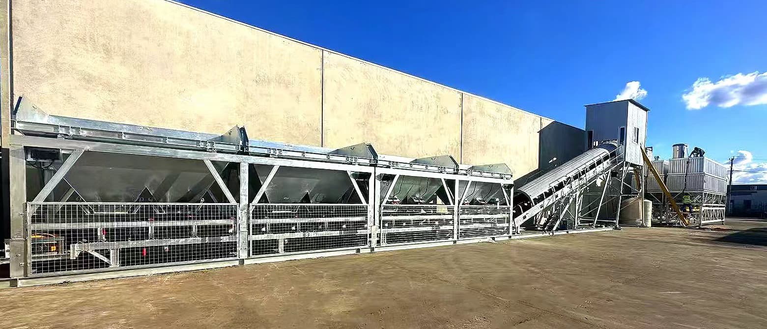 TIANYU direct-feed stationary batching plant — galvanized four-bin aggregate batcher feeding an inclined belt into the mixing house