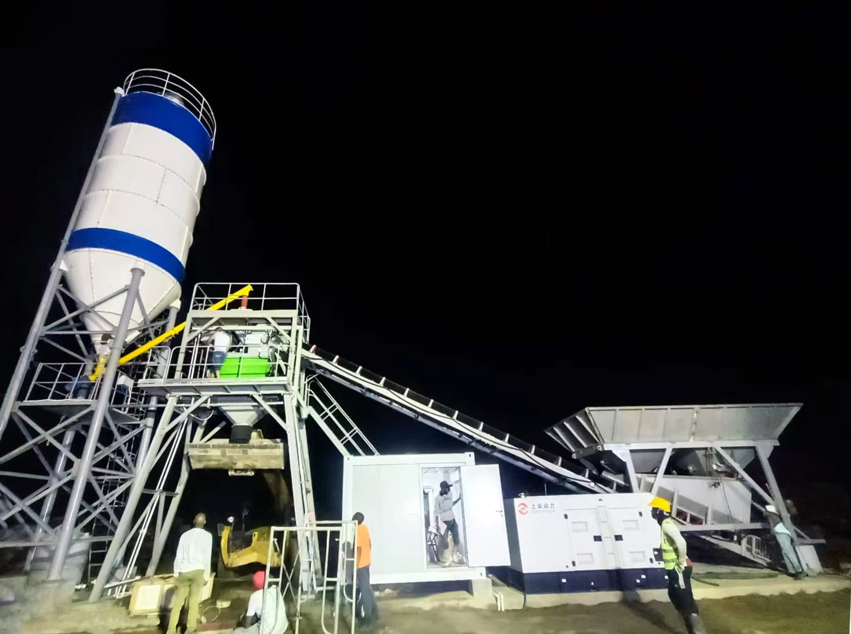TIANYU direct-feed plant being commissioned at night under floodlights with the site crew